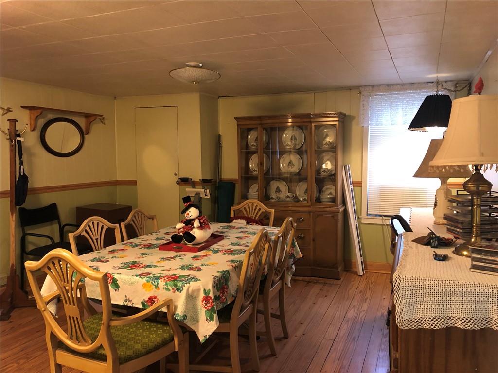 374 Ferguson Road Dunbar, PA 15431 - Photo 5 of 21 a view of a dining room with furniture and wooden floor