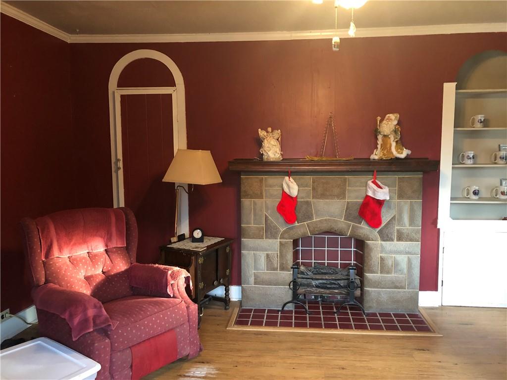 374 Ferguson Road Dunbar, PA 15431 - Photo 8 of 21 a living room with furniture and a fireplace