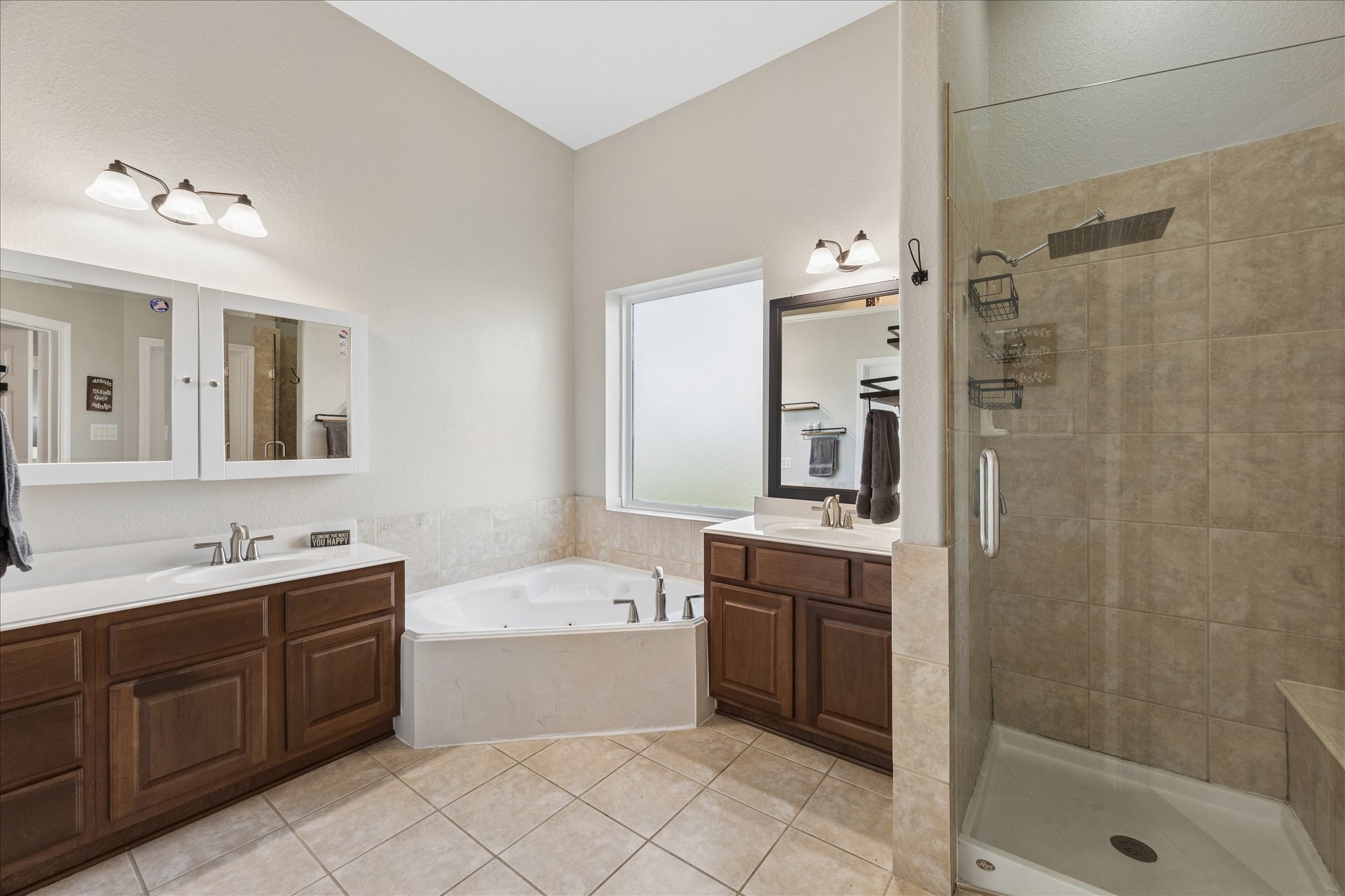 2702 Horseshoe Lane Rosharon, TX 77583 - Photo 25 of 43 Spa-inspired primary bathroom with dual vanities, soaking tub, and oversized walk-in shower.