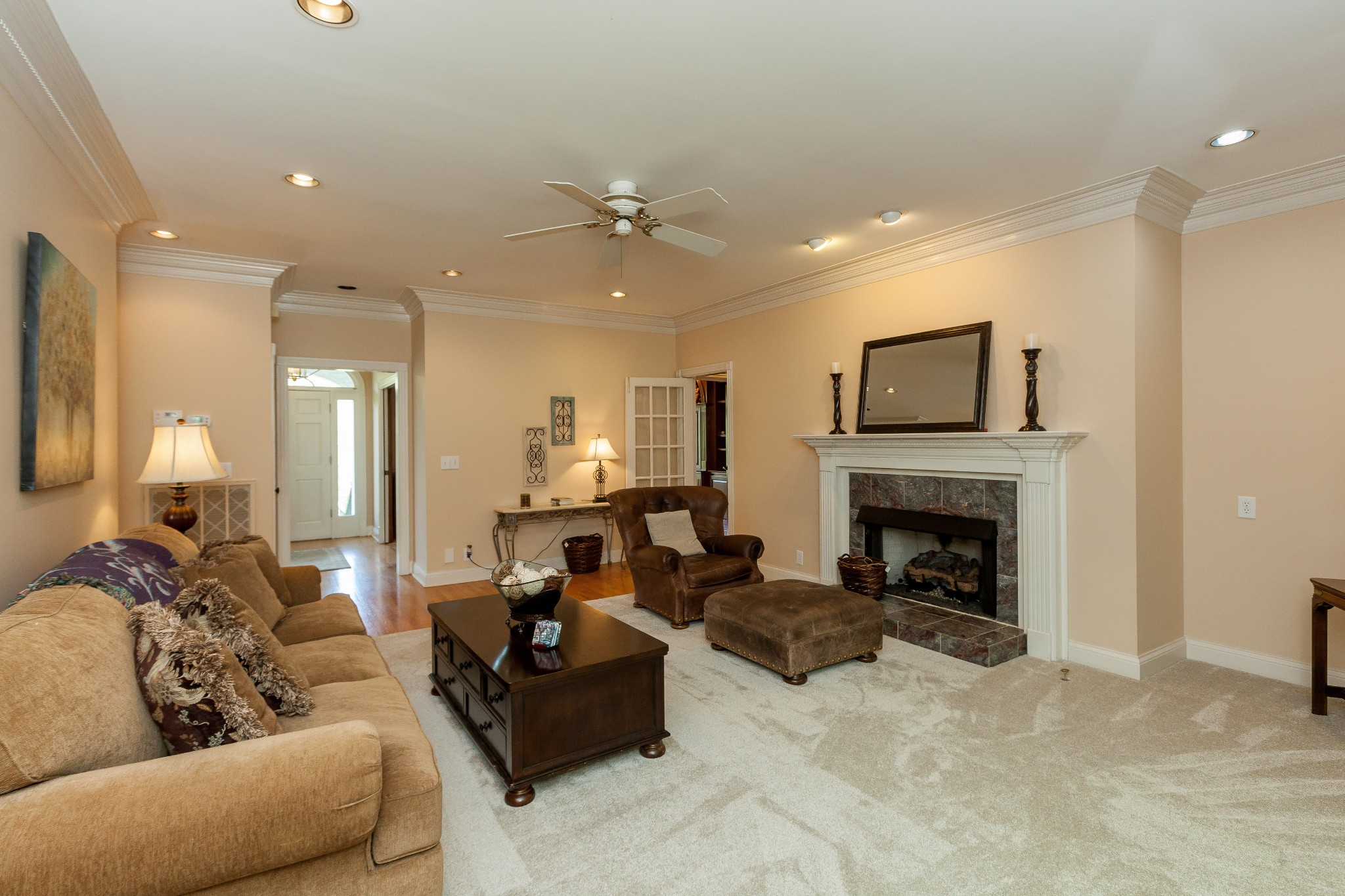 758 High Point Ridge Road Franklin, TN 37069 - Photo 14 of 28 a living room with furniture a fireplace and a flat screen tv