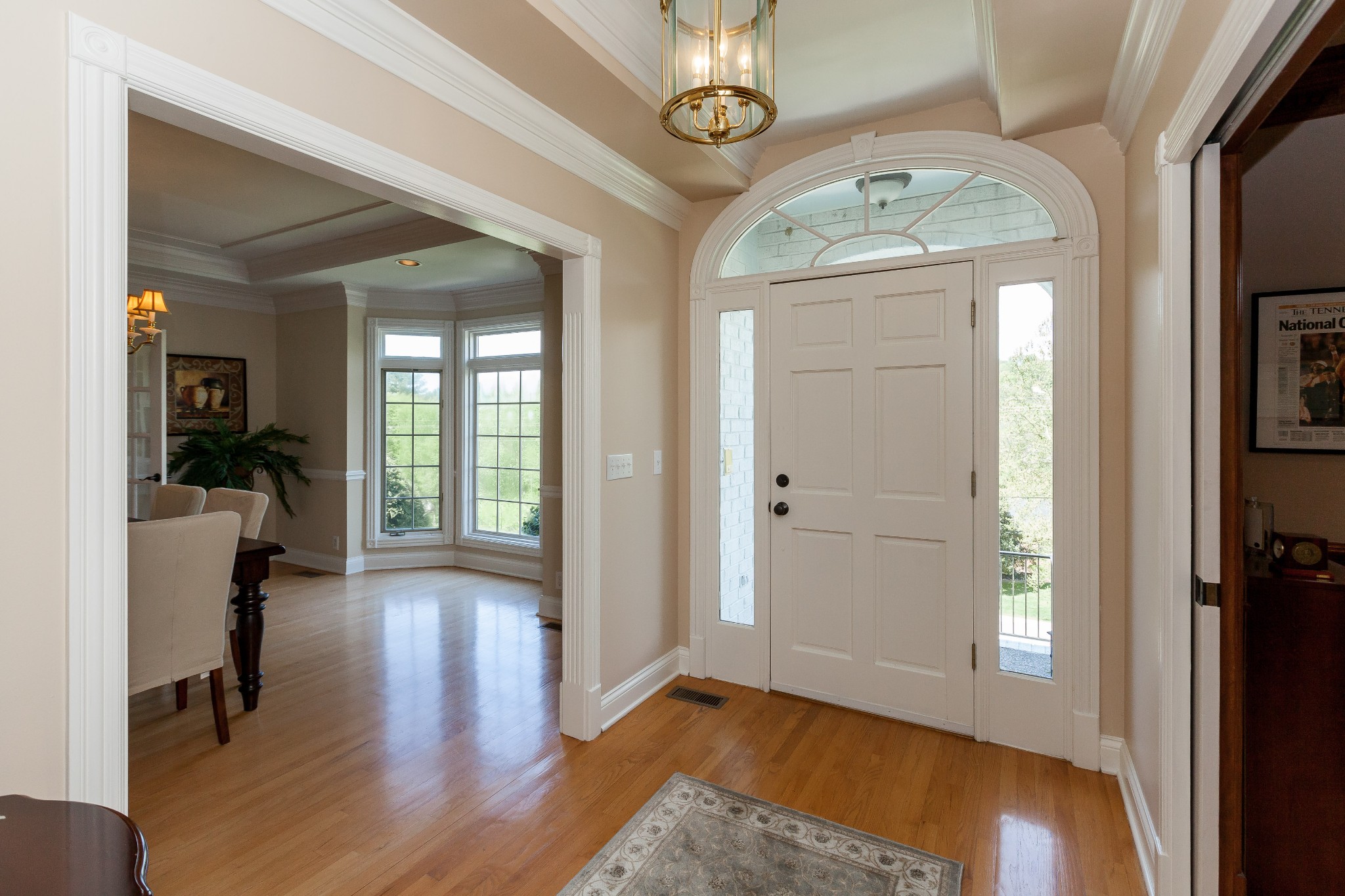 758 High Point Ridge Road Franklin, TN 37069 - Photo 7 of 28 a view of a hallway with wooden floor and a livingroom
