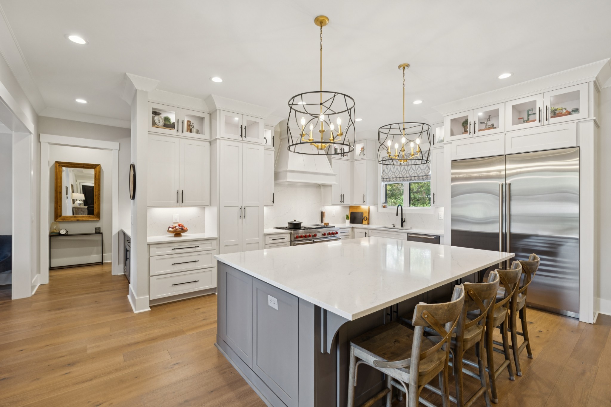 5012 Toll Rd Court Thompson's Station, TN 37179 - Photo 13 of 95 a large kitchen with granite countertop a stove a sink a refrigerator and a dining table with wooden floor
