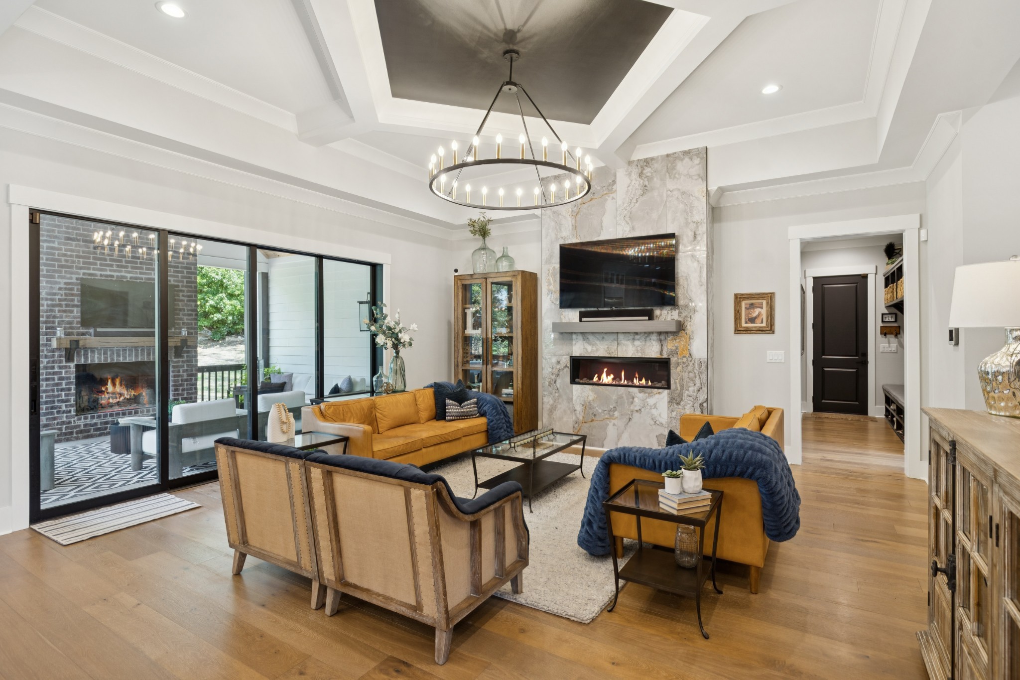 5012 Toll Rd Court Thompson's Station, TN 37179 - Photo 20 of 95 a living room with furniture a flat screen tv and kitchen view
