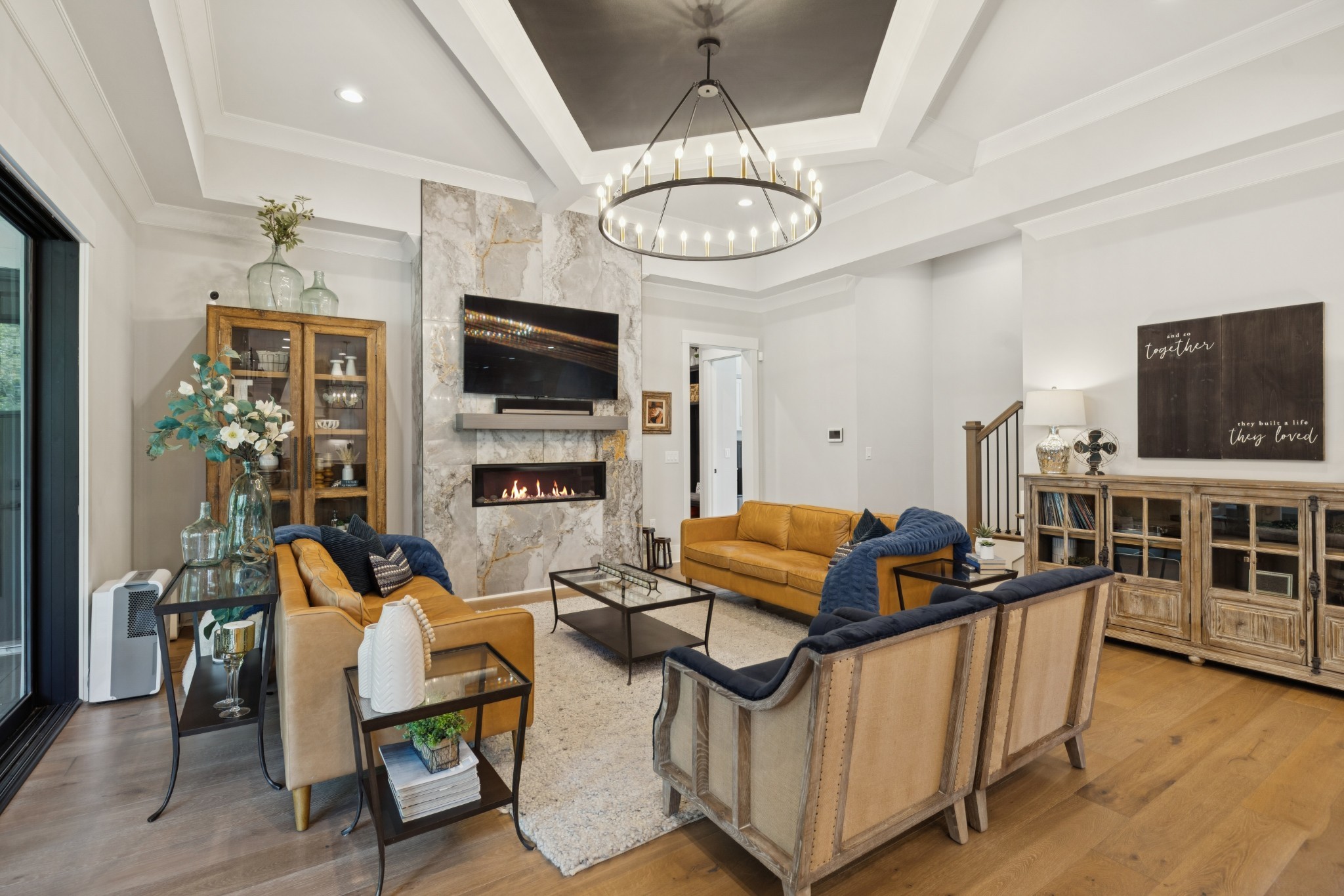 5012 Toll Rd Court Thompson's Station, TN 37179 - Photo 22 of 95 a living room with furniture a flat screen tv and kitchen view