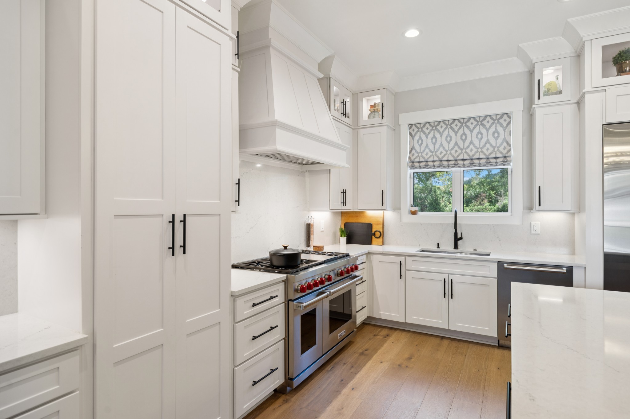 5012 Toll Rd Court Thompson's Station, TN 37179 - Photo 25 of 95 a kitchen with stainless steel appliances a sink a stove a refrigerator cabinets and a window