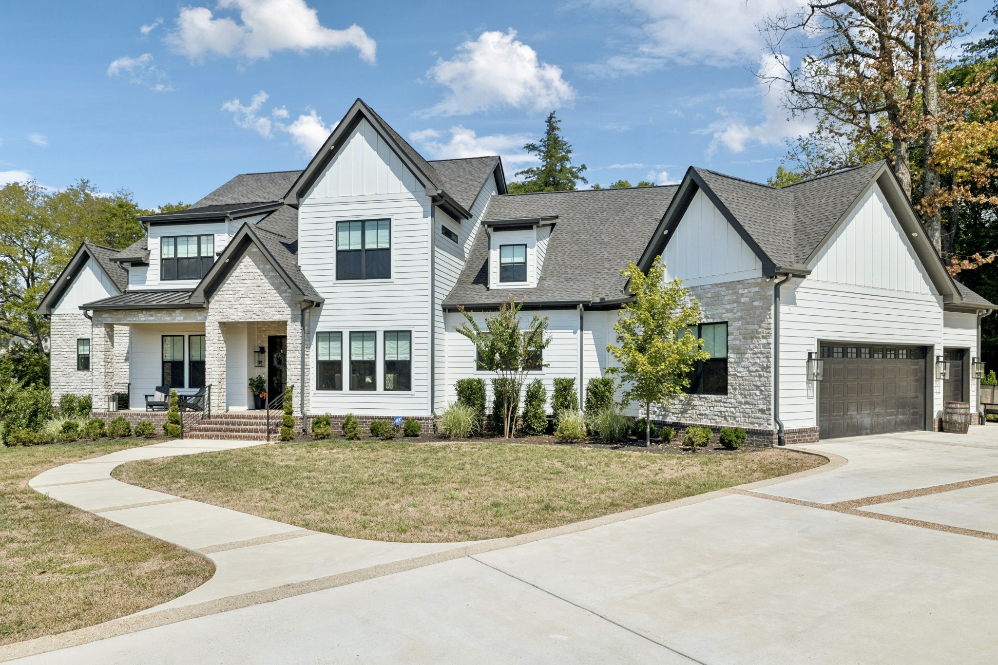 5012 Toll Rd Court Thompson's Station, TN 37179 - Photo 3 of 95 a front view of a house with a yard