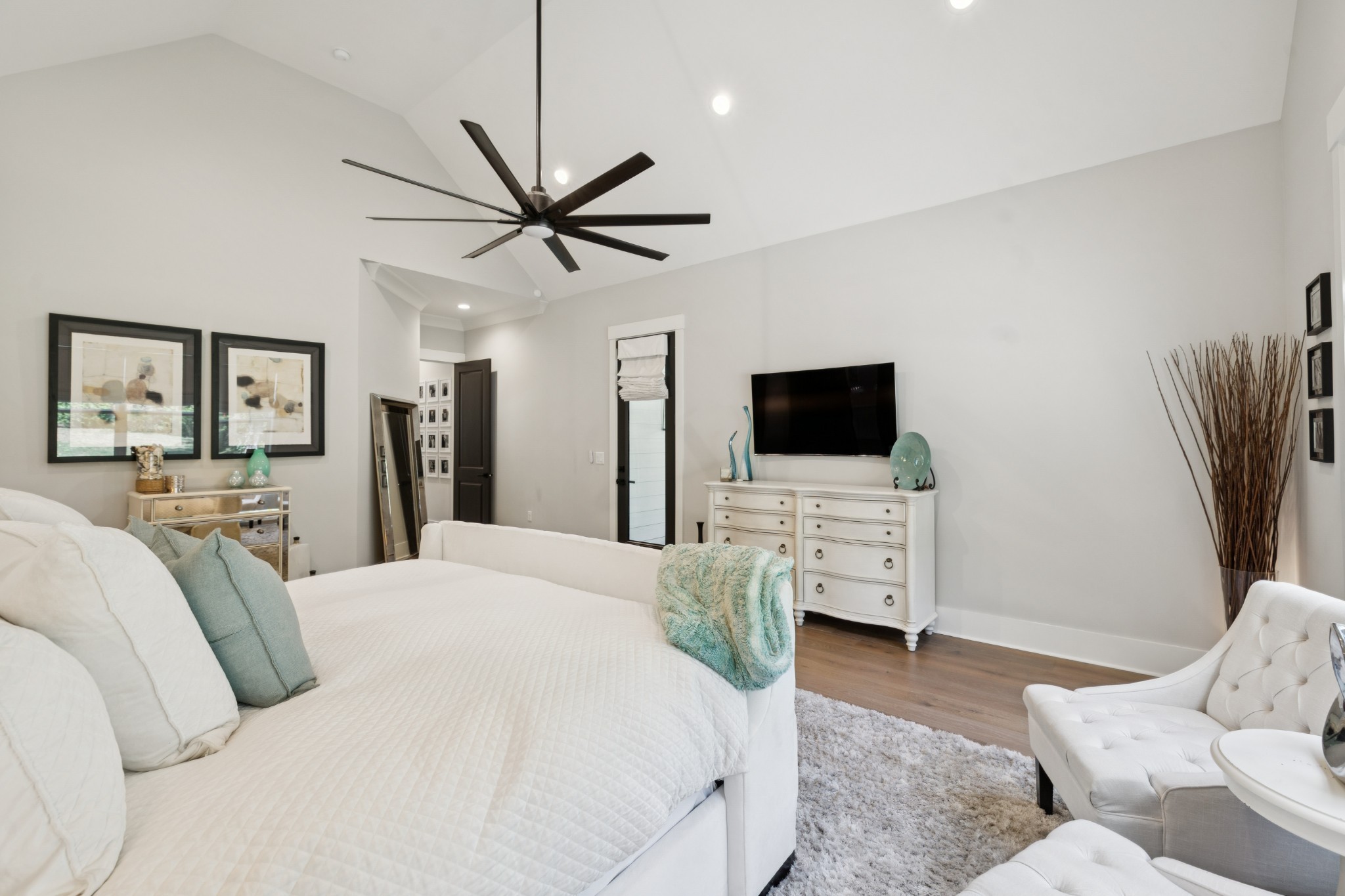 5012 Toll Rd Court Thompson's Station, TN 37179 - Photo 32 of 95 a bedroom with a bed flat screen tv and a couch