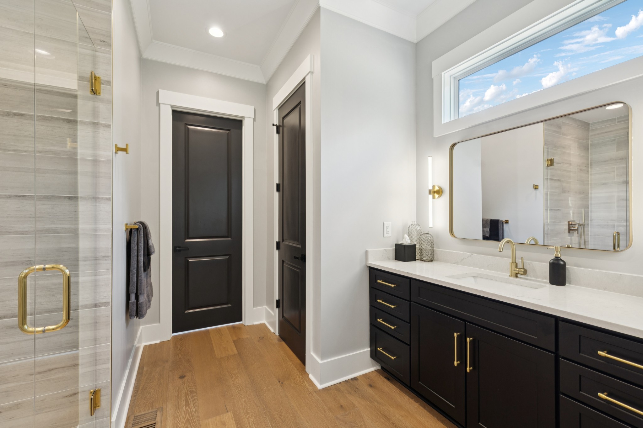 5012 Toll Rd Court Thompson's Station, TN 37179 - Photo 39 of 95 a bathroom with a double vanity sink a mirror and a shower