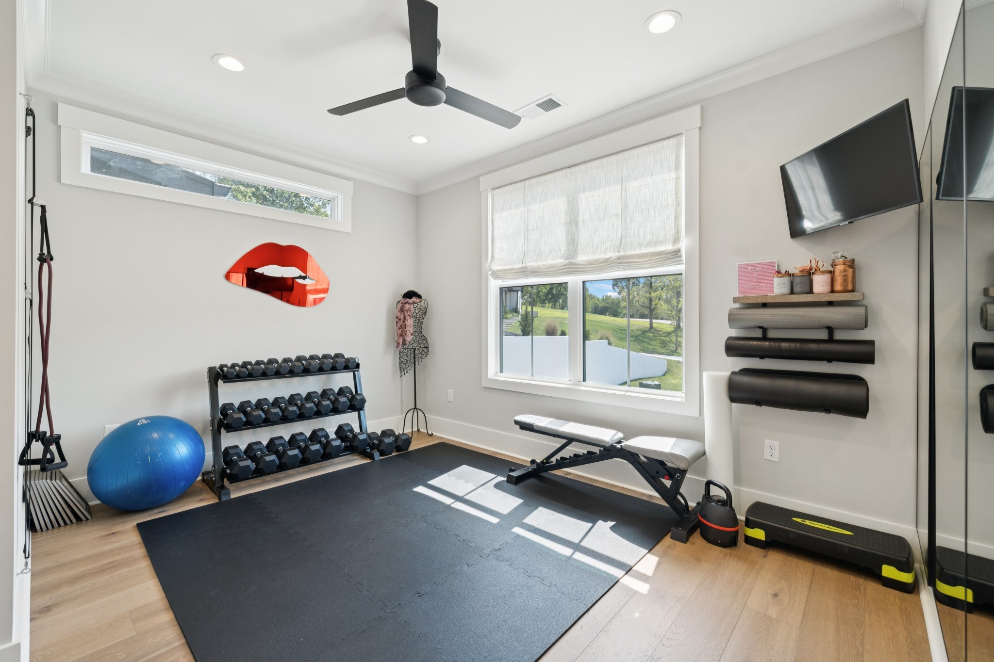 5012 Toll Rd Court Thompson's Station, TN 37179 - Photo 50 of 95 a room with gym equipment and a flat screen tv