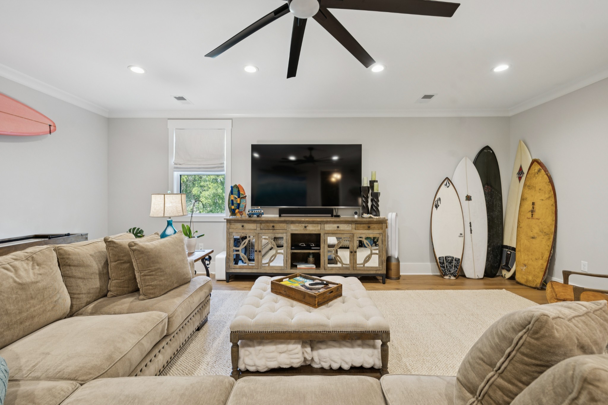 5012 Toll Rd Court Thompson's Station, TN 37179 - Photo 52 of 95 a living room with furniture a flat screen tv and a chandelier