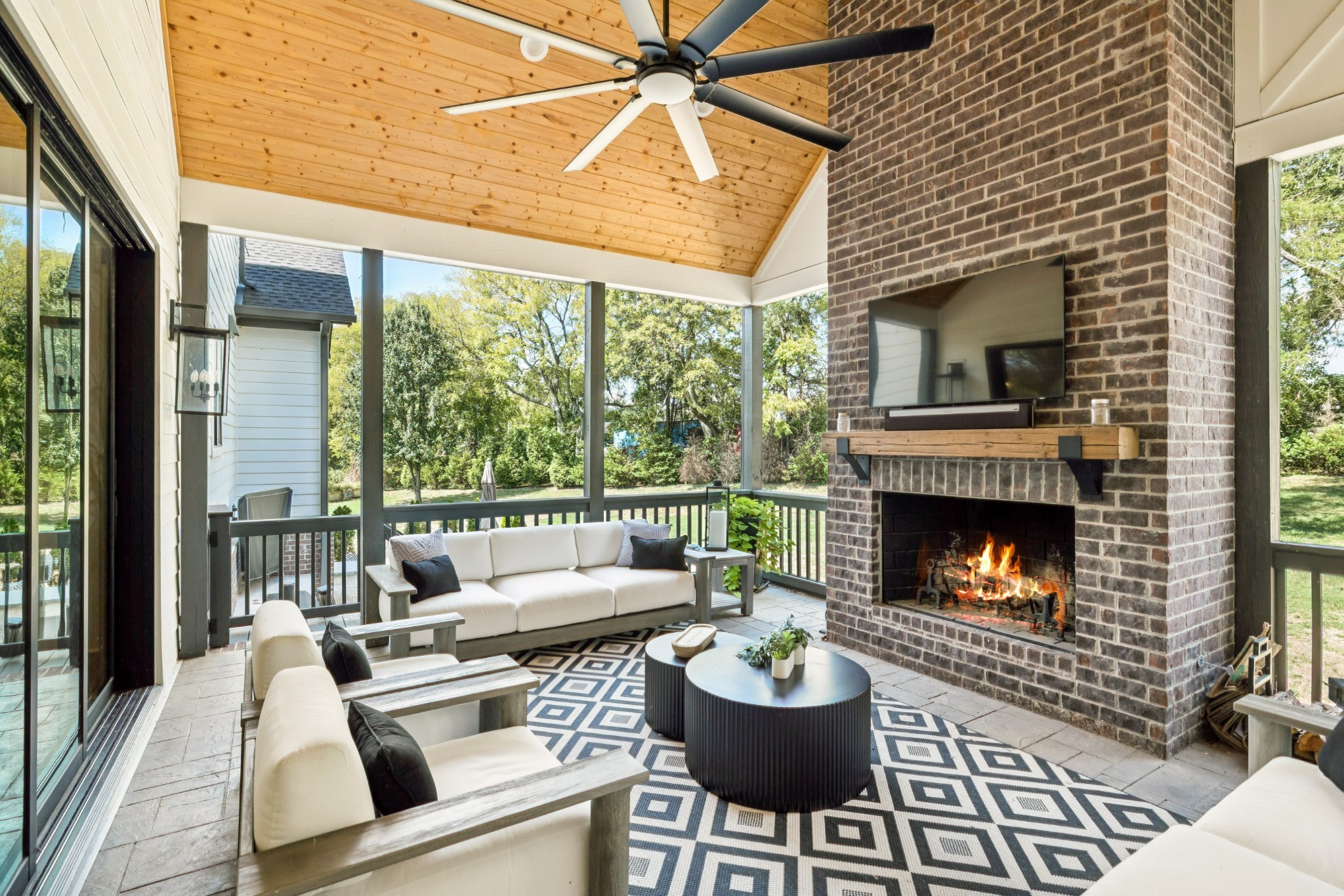 5012 Toll Rd Court Thompson's Station, TN 37179 - Photo 62 of 95 a living room with furniture a fireplace and a large window