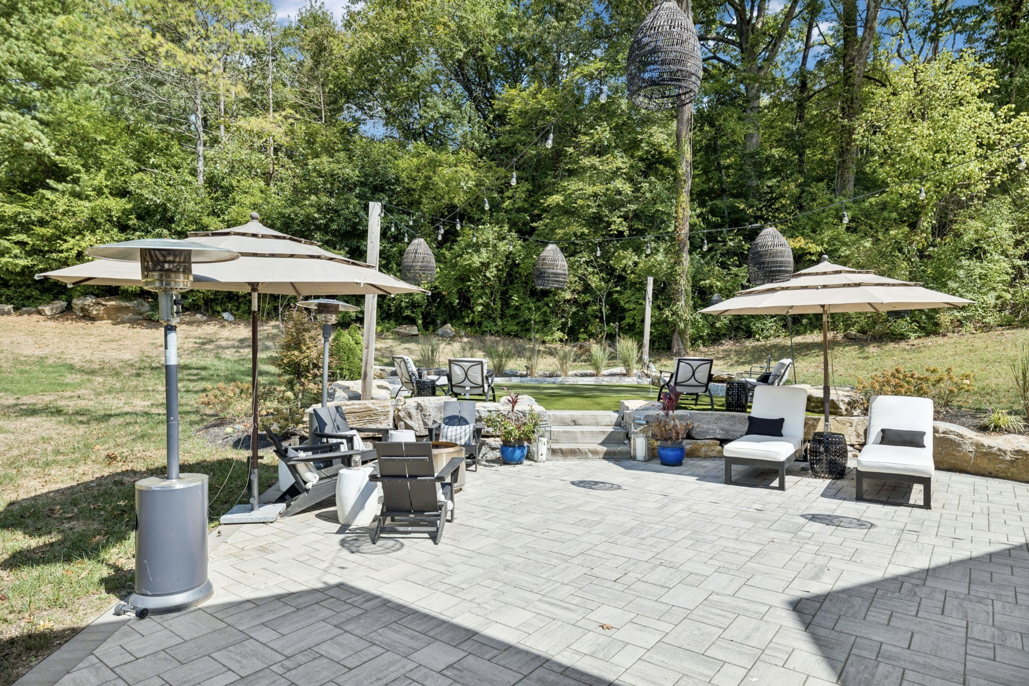 5012 Toll Rd Court Thompson's Station, TN 37179 - Photo 69 of 95 an outdoor space with patio and white umbrellas