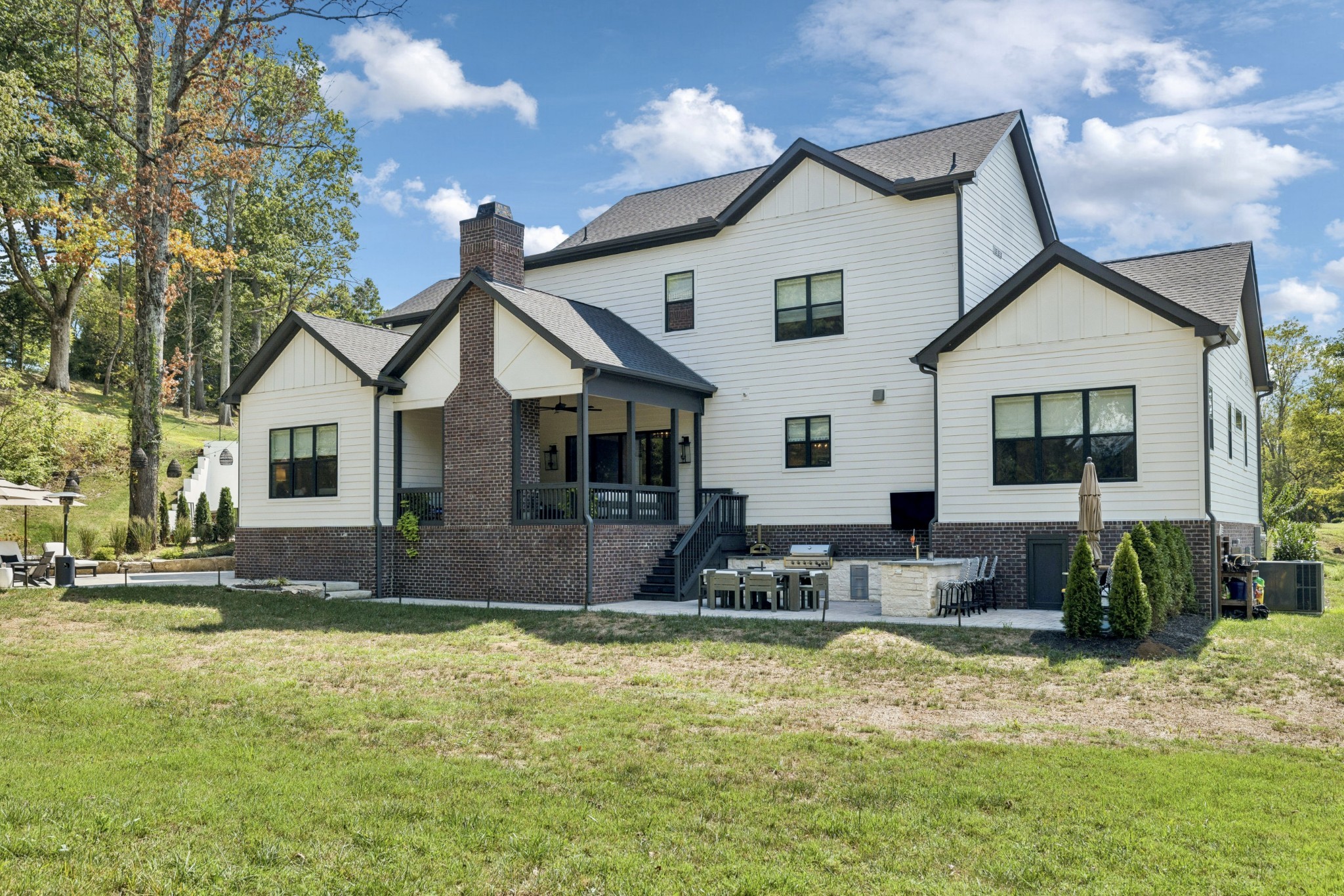 5012 Toll Rd Court Thompson's Station, TN 37179 - Photo 78 of 95 a front view of house with yard outdoor seating and yard