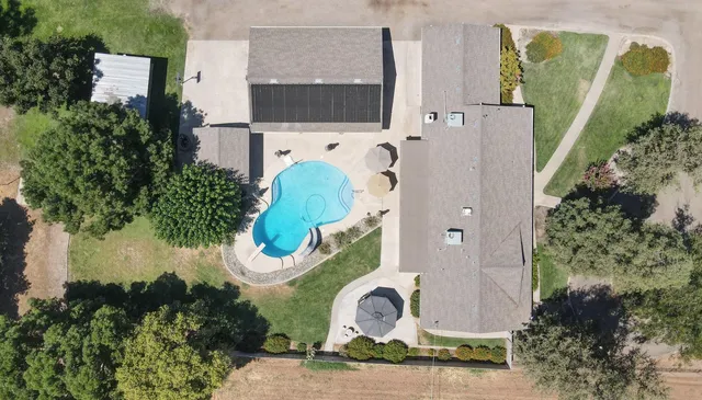 a dining room with furniture a window and a chandelier