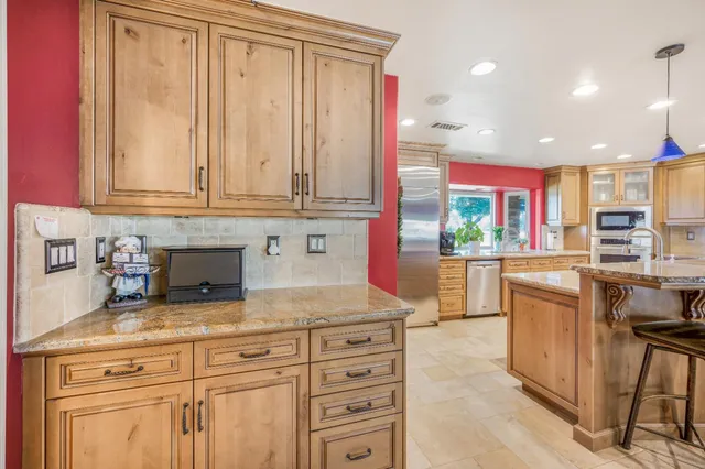 a view of a storage and utility room with washer and dryer