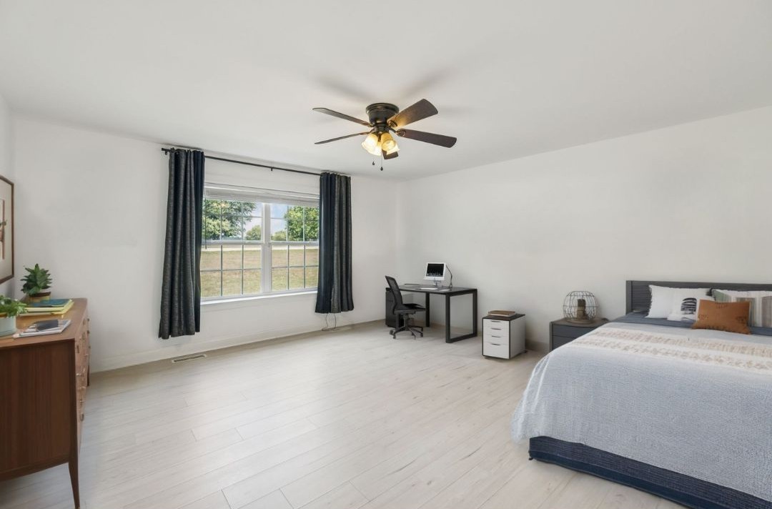 68 Taylor Road Manchester, TN 37355 - Photo 14 of 33 a spacious bedroom with two beds and a chandelier