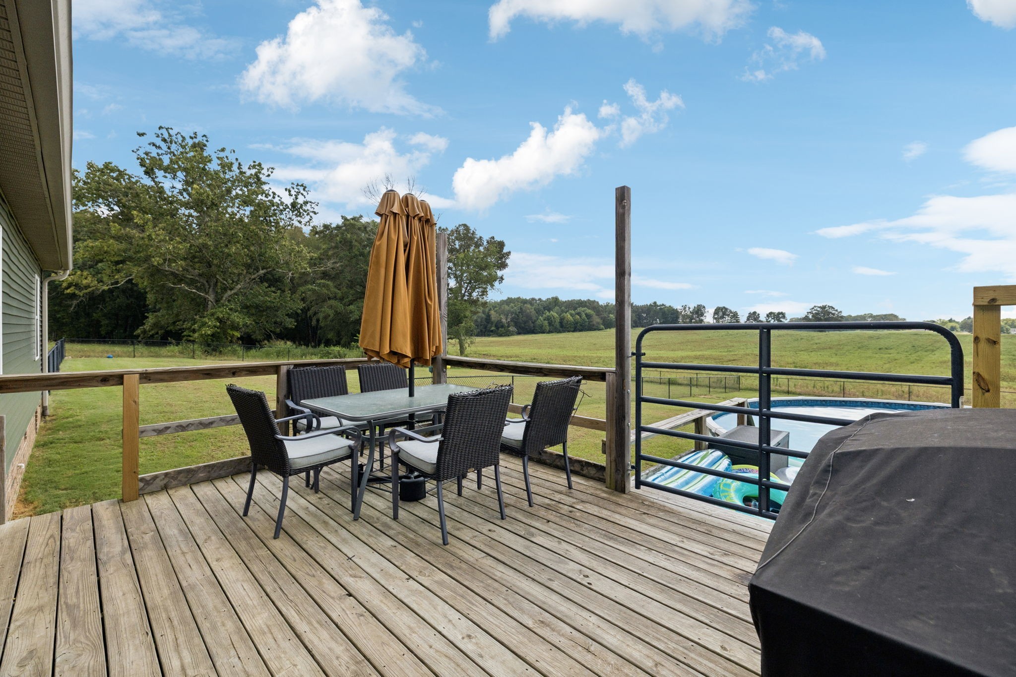 68 Taylor Road Manchester, TN 37355 - Photo 22 of 33 a view of a terrace with wooden floor and bench