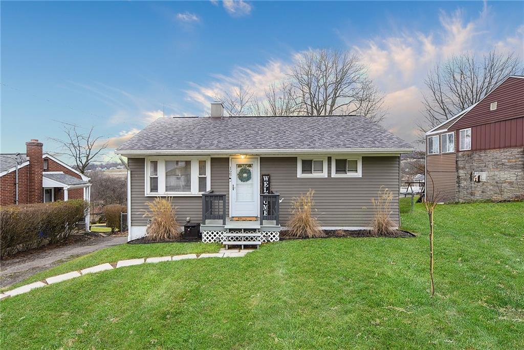 127 Sunset Drive Washington, PA 15301 - Photo 1 of 33 a front view of a house with a yard and porch