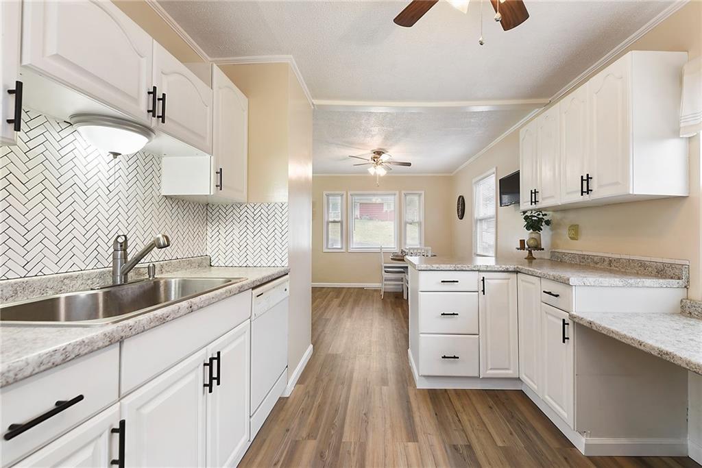 127 Sunset Drive Washington, PA 15301 - Photo 13 of 33 a kitchen with granite countertop white cabinets white stainless steel appliances and sink