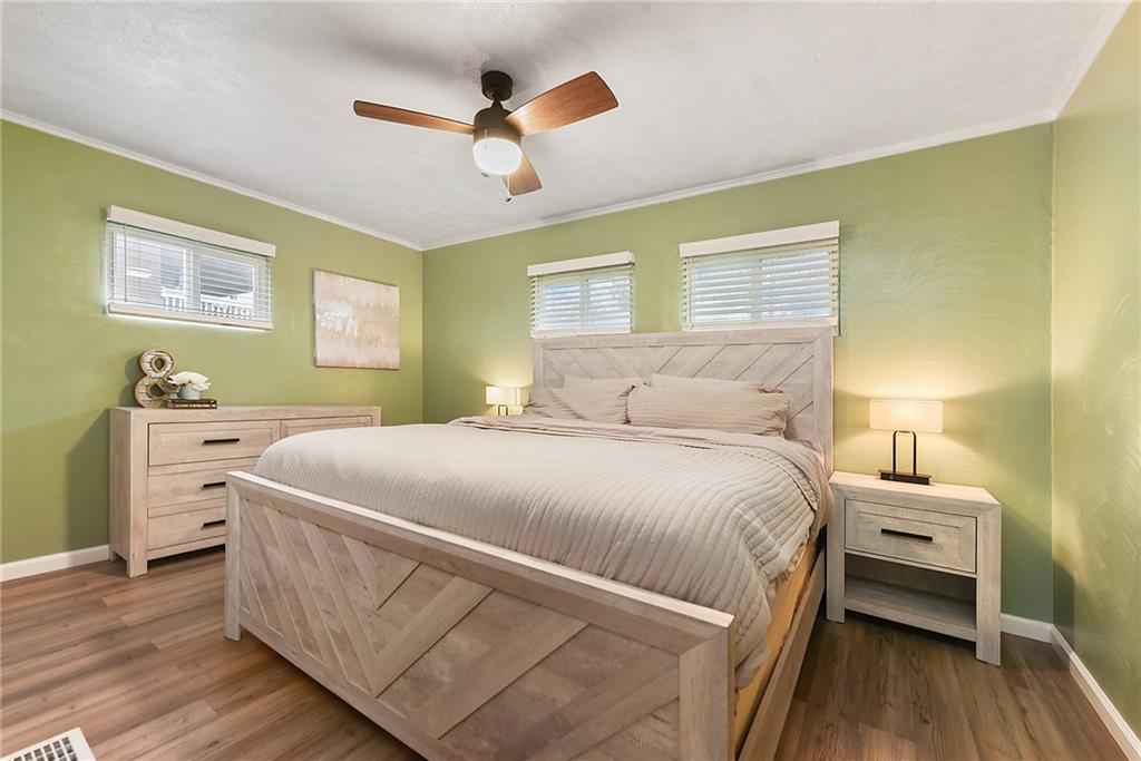 127 Sunset Drive Washington, PA 15301 - Photo 16 of 33 a bedroom with a bed and a chandelier