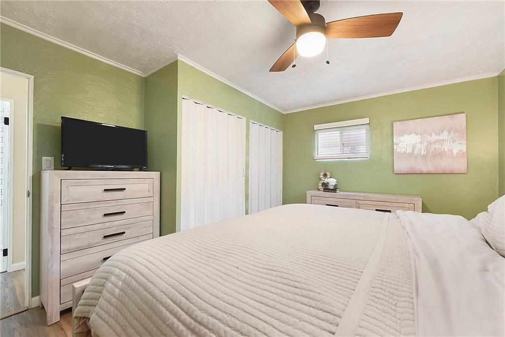 127 Sunset Drive Washington, PA 15301 - Photo 17 of 33 a bedroom with a bed and a flat tv screen on dresser