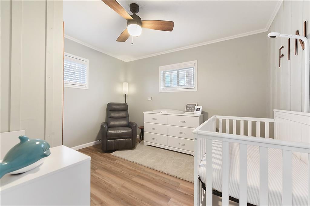 127 Sunset Drive Washington, PA 15301 - Photo 19 of 33 a bedroom with a bed and a chandelier