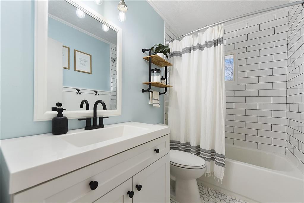 127 Sunset Drive Washington, PA 15301 - Photo 20 of 33 a bathroom with a sink a toilet and shower