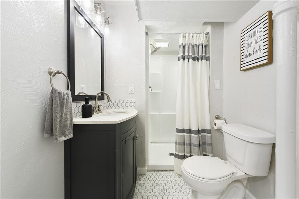 127 Sunset Drive Washington, PA 15301 - Photo 22 of 33 a bathroom with a toilet sink shower