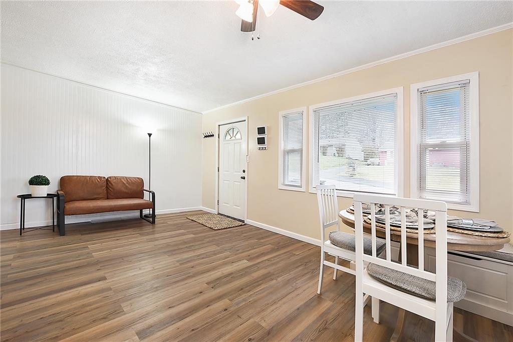 127 Sunset Drive Washington, PA 15301 - Photo 4 of 33 a living room with furniture a flat screen tv and windows