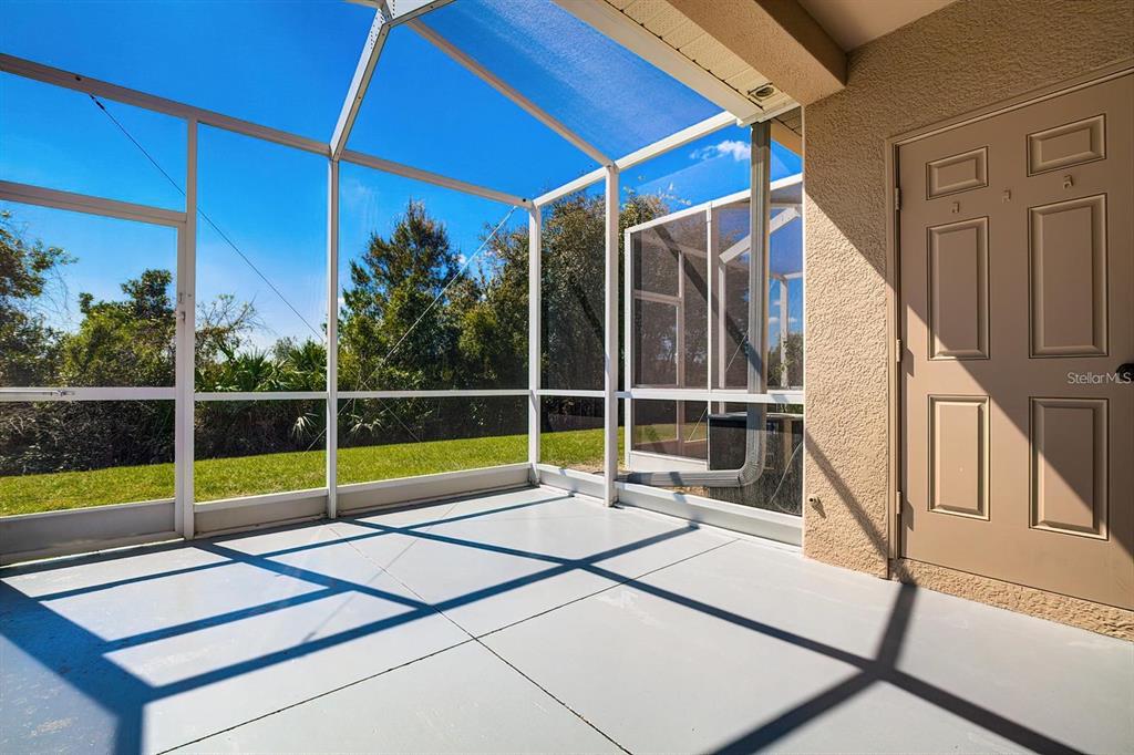 15706 Stable Run Drive Spring Hill, FL 34610 - Photo 36 of 40 a view of a house with porch and wooden floor