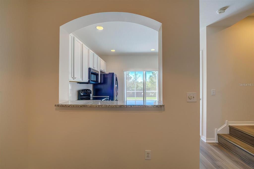 15706 Stable Run Drive Spring Hill, FL 34610 - Photo 10 of 40 a view of a kitchen with wooden floor and a window