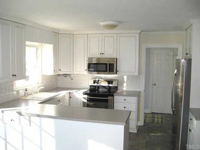 308 Sandhurst Road Raleigh, NC 27615 - Photo 5 of 12 Spacious kitchen with pantry & new stainless steel appliances Kitchen