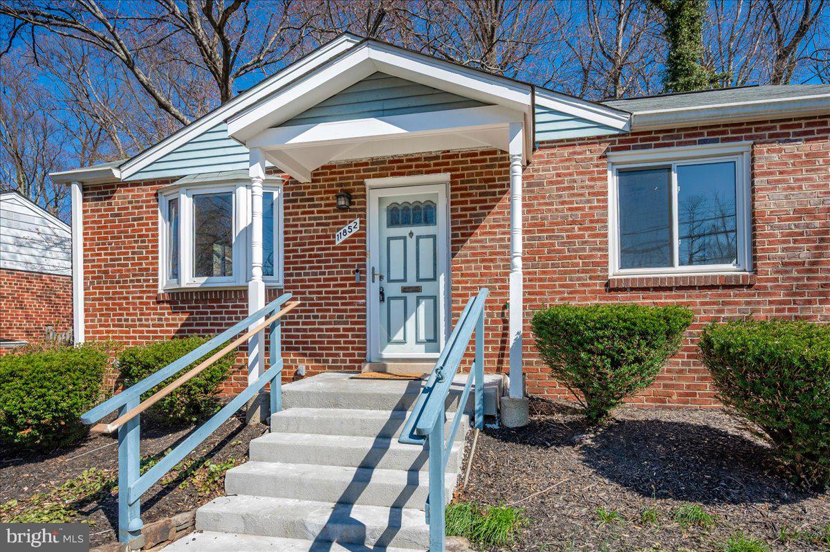 Charming brick home with inviting entry.