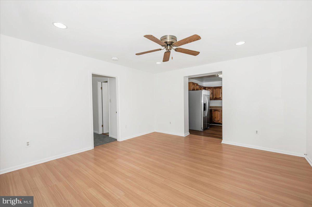 11852 Huggins Drive Silver Spring, MD 20902 - Photo 17 of 63 a view of a big room with wooden floor and cabinet