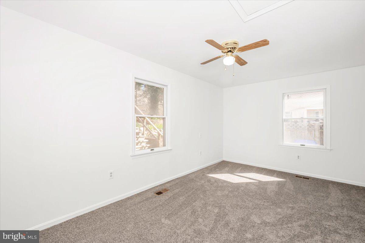 11852 Huggins Drive Silver Spring, MD 20902 - Photo 18 of 63 an empty room with windows and fan
