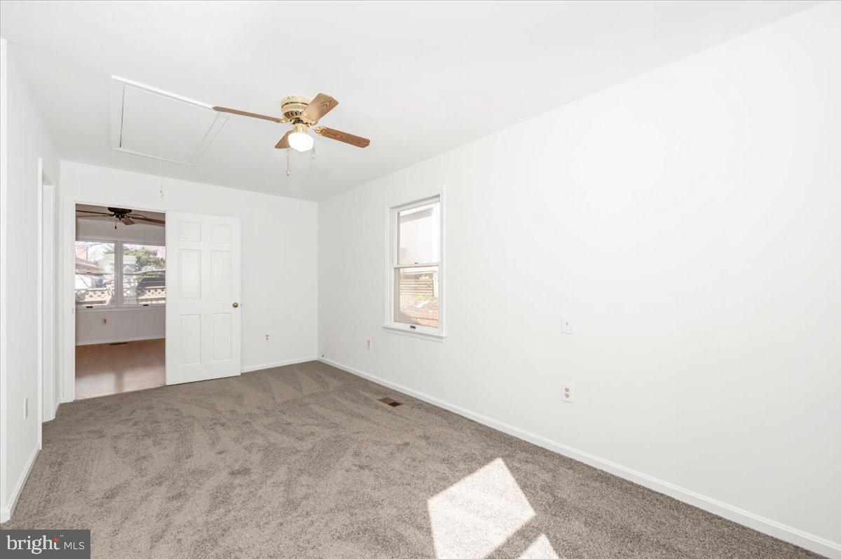 11852 Huggins Drive Silver Spring, MD 20902 - Photo 19 of 63 a view of a room with a ceiling fan and window
