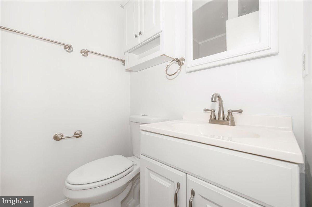 11852 Huggins Drive Silver Spring, MD 20902 - Photo 21 of 63 a bathroom with a sink a toilet and shower