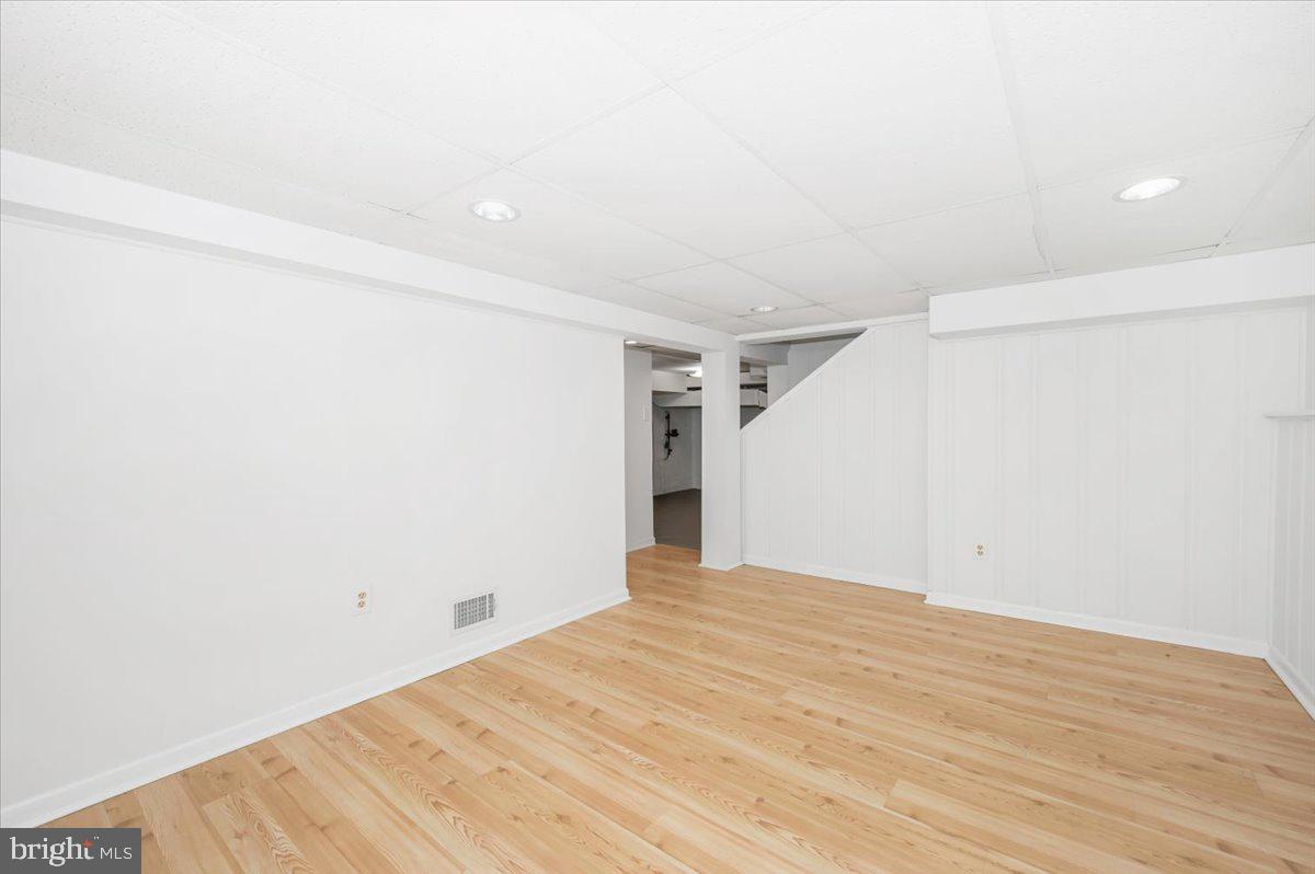 11852 Huggins Drive Silver Spring, MD 20902 - Photo 31 of 63 a view of empty room with wooden floor