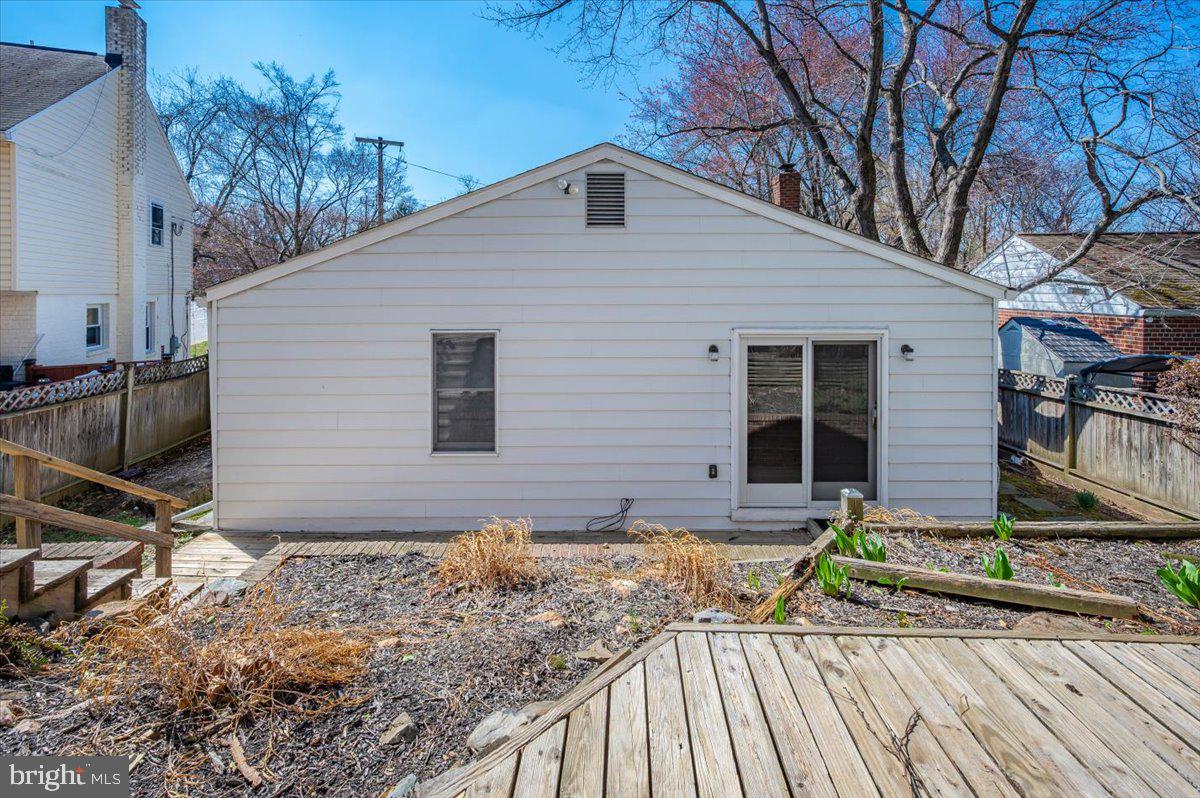 11852 Huggins Drive Silver Spring, MD 20902 - Photo 39 of 63 a front view of a house with garden