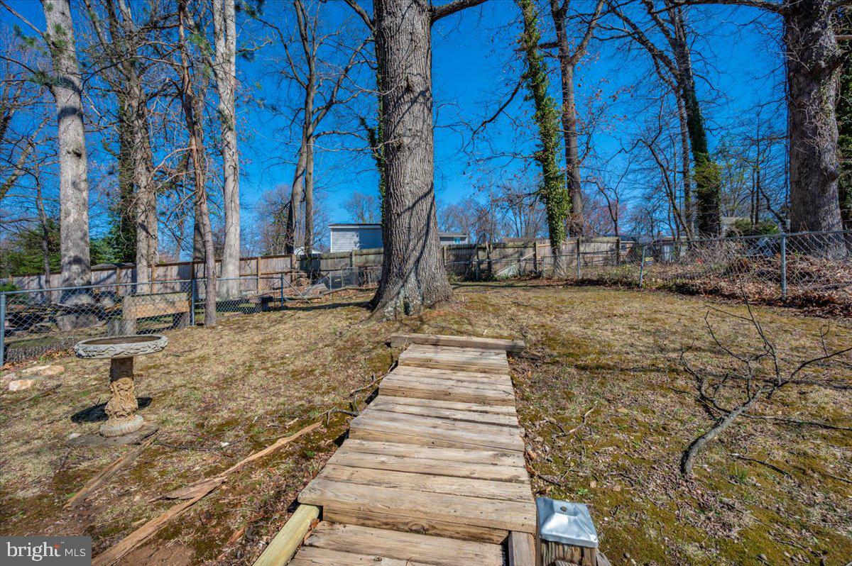 11852 Huggins Drive Silver Spring, MD 20902 - Photo 51 of 63 a view of a yard with wooden fence