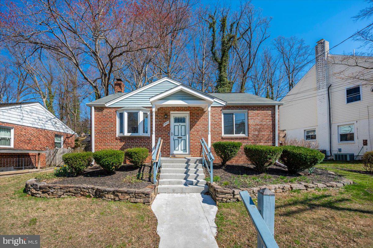 11852 Huggins Drive Silver Spring, MD 20902 - Photo 61 of 63 a front view of a house with garden