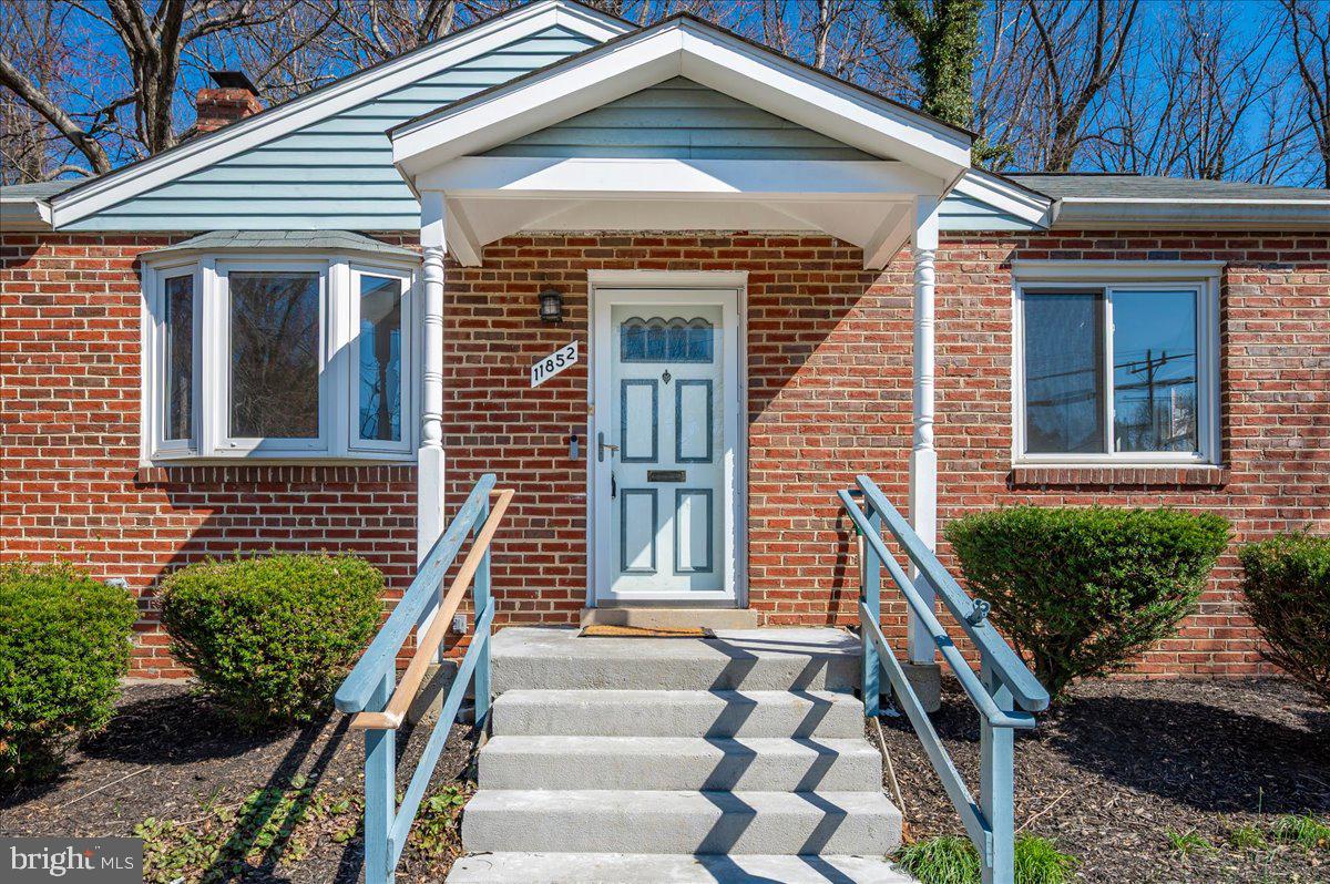 11852 Huggins Drive Silver Spring, MD 20902 - Photo 63 of 63 a front view of a house with a yard