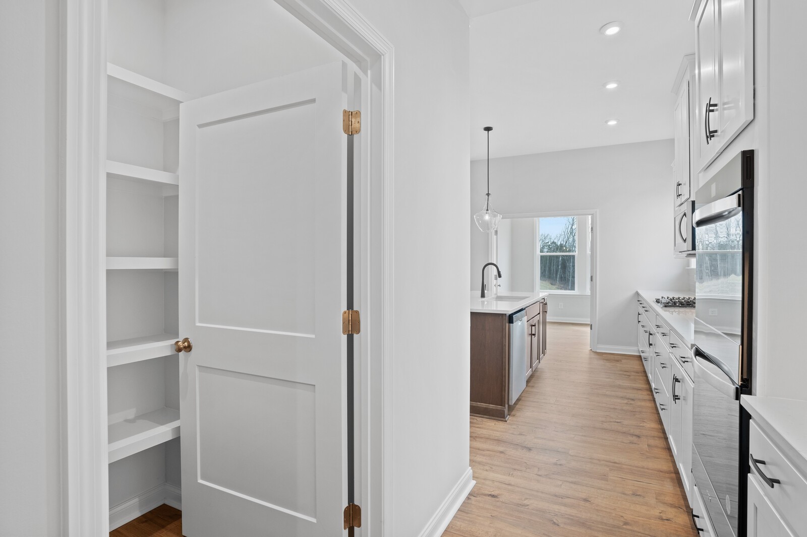 1709 Merkel Road Columbia, TN 38401 - Photo 26 of 44 a hallway with white cabinets and white appliances