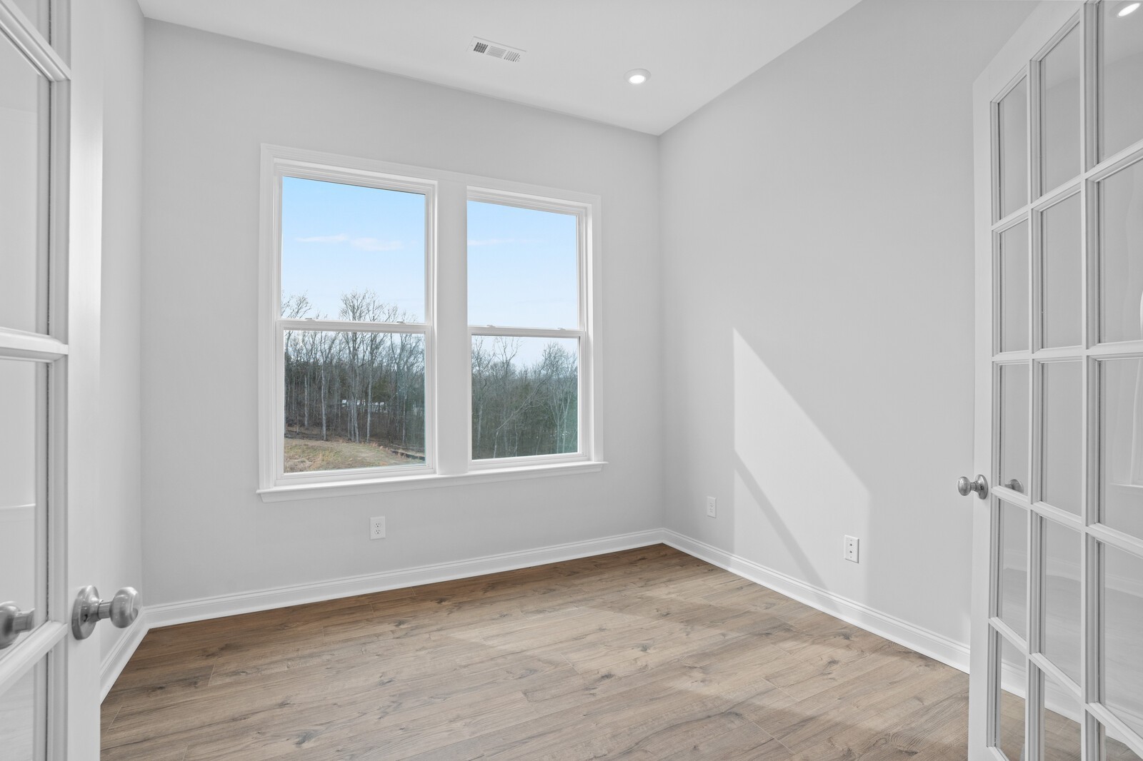1709 Merkel Road Columbia, TN 38401 - Photo 30 of 44 an empty room with wooden floor and windows