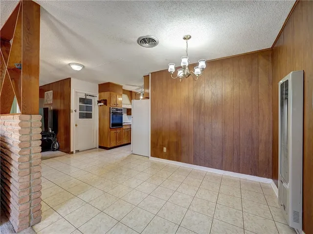 a view of a kitchen with a refrigerator a sink and dishwasher