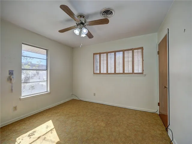a view of an empty room and window