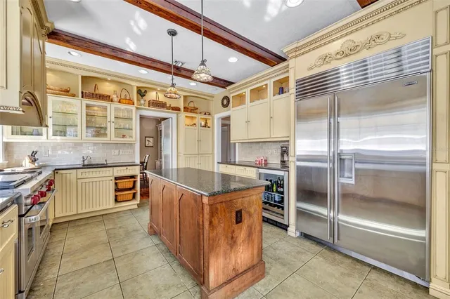 a kitchen with stainless steel appliances granite countertop a stove and a refrigerator