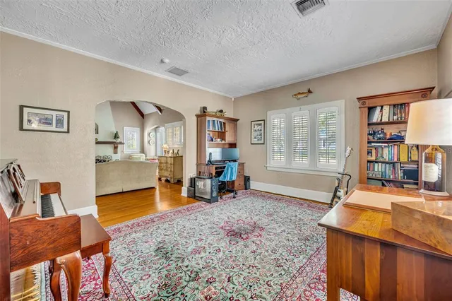 a living room with furniture and a table