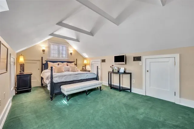 a bedroom with furniture and a window