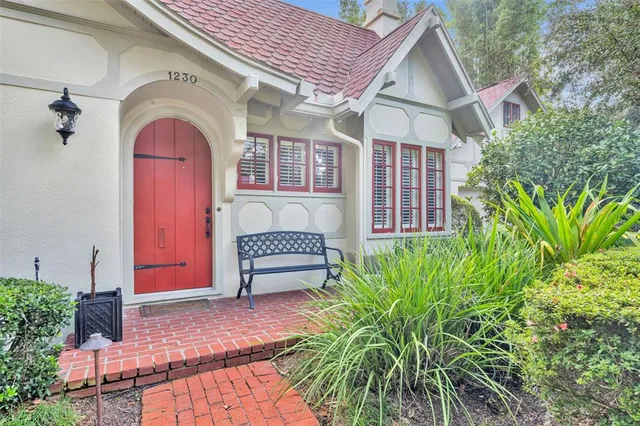 a front view of a house with garden